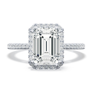 268415ec Platinum ring, top view: emerald cut center stone in a matching cut corner halo with pave band