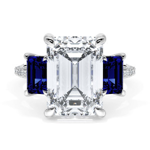40927EC12X85BSW top view, emerald cut center flanked by square blue sapphires on a pave band
