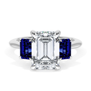 41127EC95X7BS Platinum top view, emerald cut center with step cut blue sapphire side stones on a polished white metal band