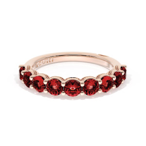415PK65RB12 wedding band angled top view showing round rubies in shared prongs on rose gold