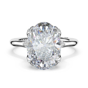 438OV125X9W engagement ring, top view of the oval center with pave tipped prongs on a plain band
