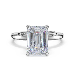 46917EC95X7W white gold ring, top view: emerald cut center stone on a slim band with crescent set accent stones