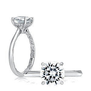 A.JAFFE ME2211Q/156 14 Karat engagement ring, a.JAFFE white gold solitaire engagement ring shown twice in one frame, standing in profile beside the round center seen from above