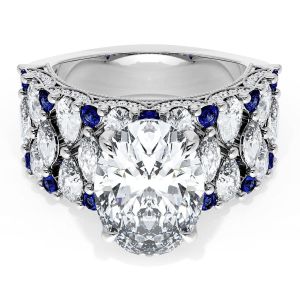 21OV125X9BS112W top view, oval center stone on wide white metal band with marquise diamonds and round blue sapphires