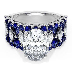 21OV125X9BS312W top view, white gold band covered in blue sapphires with white marquise accents around an oval center stone