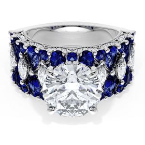 21RD10BS312W top view, round brilliant center stone on a wide white gold band of blue sapphires with marquise diamond accents