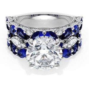 22RD10BS212 Platinum top view: round brilliant center over rows of marquise blue sapphires and diamonds