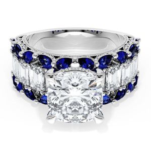 23CU9BS112 Platinum top view, cushion center stone with a step cut diamond row bordered by blue sapphires