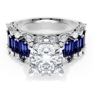 23CU9BS212 Platinum ring, top view of cushion cut center with a row of step cut blue sapphires and diamonds