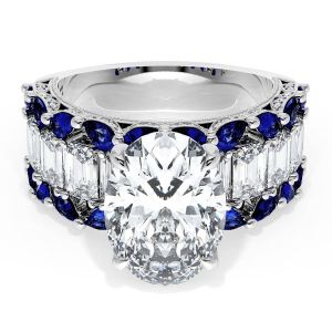 23OV125X9BS112 Platinum top view, oval center over a band of step cut diamonds bordered by blue sapphires