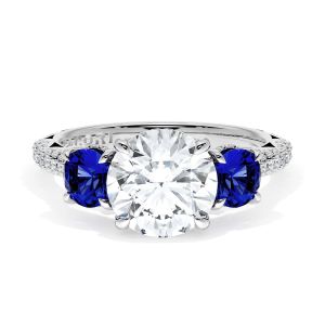 40727RD8BS Platinum top view, round brilliant center flanked by round blue sapphires on a pave band