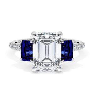 40827EC95X7BS Platinum top view, emerald cut center stone flanked by two emerald cut blue sapphires on a pave platinum band