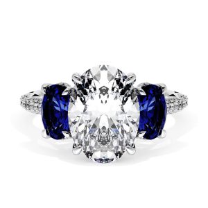 40827OV11X8BS Platinum top view, oval center stone flanked by oval blue sapphires on pave white metal band