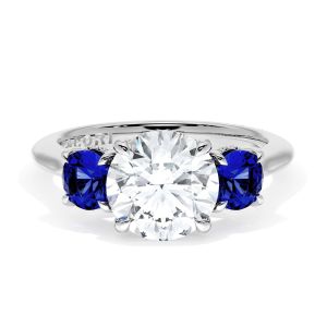 41027RD8BS Platinum top view, round brilliant center flanked by round blue sapphires on a polished white metal band