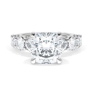 416CU9W ring top view, cushion cut center with a row of large round diamonds along the band