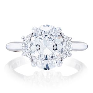 HT2690OV Platinum ring, top view of oval cut center flanked by half moon diamond side stones