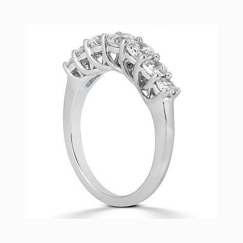 Taryn Collection ENS848B platinum wedding band, angled view of a graduated shared prong row arcing over an open under gallery