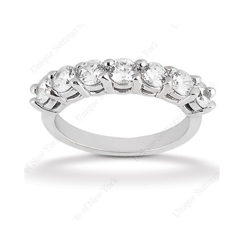 Taryn Collection WB2760 18 karat diamond band, angled view of seven round stones raised in tall shared prongs with an open under gallery
