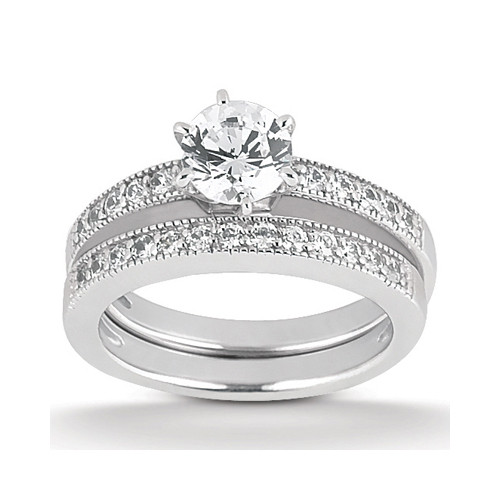 Taryn Collection ENS1067A 18 karat diamond engagement ring, angled view of the round center over a milgrain edged pave rail, shown with matching band