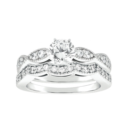 Taryn Collection ENS4085A platinum diamond engagement ring, front view of a round center over milgrain edged leaf shaped pave sections, with a matching band