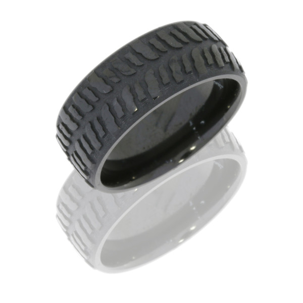 Lashbrook Z9DMUD zirconium wedding band, angled view of a domed surface carved with deep chunky mud tire tread blocks and matte recesses