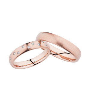 Christian Bauer 247049 14 karat rose gold diamond wedding band, angled view of a satin dome with pairs of small stones flush set at intervals around the face, shown with its matching ring