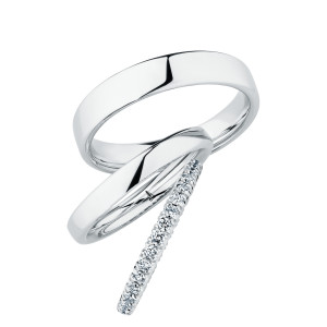 Christian Bauer 247102 platinum diamond wedding band, profile view of a dense continuous row of small round stones set in shared prongs on a rounded profile, shown with its matching rings