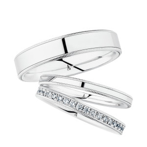 Christian Bauer 247107 18 karat white gold diamond wedding band, angled view of a flat profile with a bright row of round bead set stones framed by milgrain rails, shown with its matching rings
