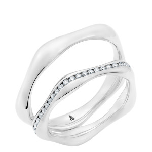 Christian Bauer 247145 14 karat white gold diamond wedding band, angled view of a polished sculpted profile with a wavy outline and a channel of small stones following the wave, shown with its matching ring