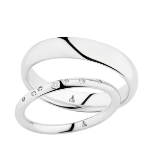 Christian Bauer 270539 18 karat white gold wedding band, angled view of a softly domed mirror polished surface rolling into the edges without any bevel over a polished interior, shown with its matching ring