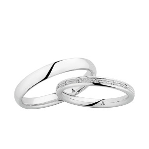 Christian Bauer 270828 18 karat white gold wedding band, angled view of a softly domed mirror polished surface with rounded edges and no groove above a bright polished interior, shown with its matching ring