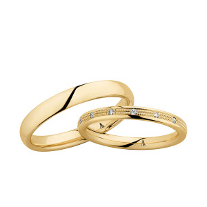 Christian Bauer 270828 18 karat yellow gold wedding band, angled view of a softly domed mirror polished surface with rounded edges and no groove above a bright polished interior, shown with its matching ring