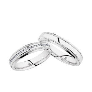 Christian Bauer 274577 18 karat white gold wedding band, angled view of a flat mirror polished face with a milgrain line inside each narrow polished stepped rim, shown with its matching ring
