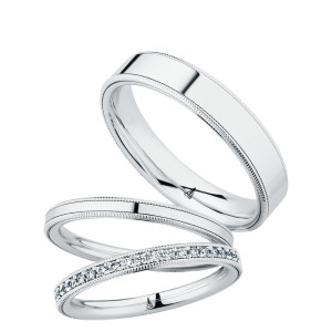 Christian Bauer 274663 platinum wedding band, angled view of a flat polished face bordered by a fine milgrain rail along each edge, shown with its matching rings