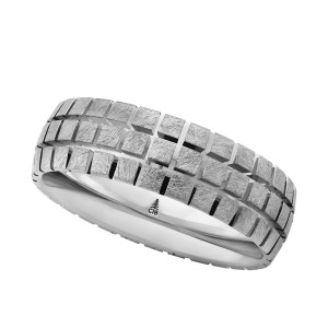 Christian Bauer 274753 platinum wedding band, angled view of a face grooved into staggered rows of raised square tiles in a scratched matte finish