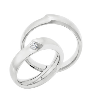 Christian Bauer 274782 18 karat white gold wedding band, angled view of a polished flat face with one shank end overlapping the other at a raised diagonal step, shown with its matching ring