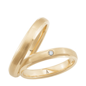 Christian Bauer 274791 14 karat yellow gold wedding band, angled view of a brushed court profile with bright polished bevels along both edges, shown with its matching ring