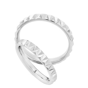 Christian Bauer 274802 18 karat white gold wedding band, angled view of a bright polished surface cut into a continuous row of raised pyramid facets around the outside, shown with its matching ring