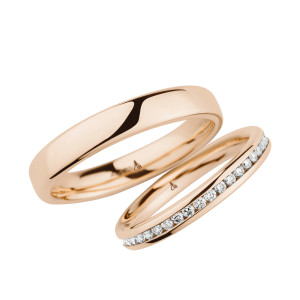 Christian Bauer 280096 14 karat rose gold wedding band, angled view of a mirror polished court dome with no edge treatment curving straight into the polished interior, shown with its matching ring