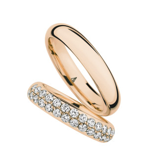 Christian Bauer 280097 14 karat rose gold wedding band, angled view of a mirror polished full half round dome with no edge treatment above a polished interior, shown with its matching ring