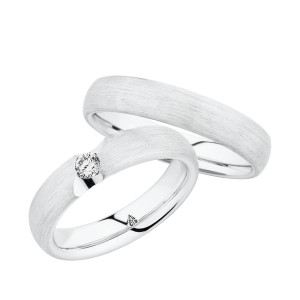 Christian Bauer 280143 18 karat white gold wedding band, angled view of a softly domed profile with a fine brushed surface running unbroken into a polished interior, shown with its matching ring