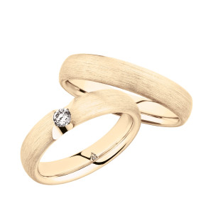Christian Bauer 280143 18 karat yellow gold wedding band, angled view of a softly domed profile with a fine brushed surface running unbroken into a polished interior, shown with its matching ring