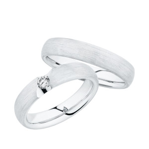 Christian Bauer 280143 platinum wedding band, angled view of a softly domed profile with a fine brushed surface running unbroken into a polished interior, shown with its matching ring