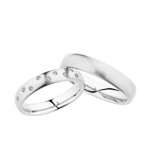 Christian Bauer 280147 14 karat white gold wedding band, angled view of a softly domed profile with a satin brushed surface and a bright polished interior, shown with its matching ring