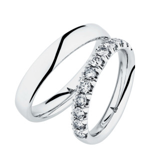 Christian Bauer 280148 platinum wedding band, angled view of a low polished dome curving unbroken into rounded edges above a polished interior, shown with its matching ring