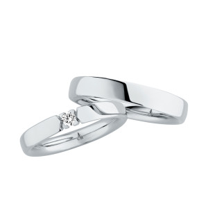 Christian Bauer 280159 platinum wedding band, angled view of a low polished dome with softly rounded edges above a polished interior, no groove or bevel, shown with its matching ring