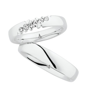 Christian Bauer 280165 18 karat white gold wedding band, angled view of a full rounded dome with a bright polished surface and a polished interior, no edge treatment, shown with its matching ring
