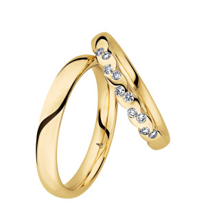 Christian Bauer 280179 18 karat yellow gold wedding band, angled view of a full round dome with a bright polished surface curving straight into a polished interior, shown with its matching ring