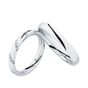 Christian Bauer 280195 platinum wedding band, angled view of a full round polished dome with a soft edge break into a mirror polished interior, shown with its matching ring