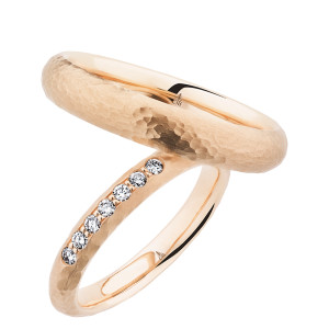 Christian Bauer 280198 14 karat rose gold wedding band, angled view of a domed profile with a hammered surface of visible dimples above a bright polished interior, shown with its matching ring